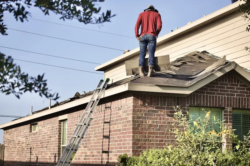 Professional roofer working on a residential roof in Yocum Estates